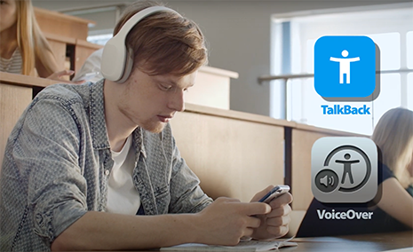 a student in class with headphones using accessibility features to listen to their device